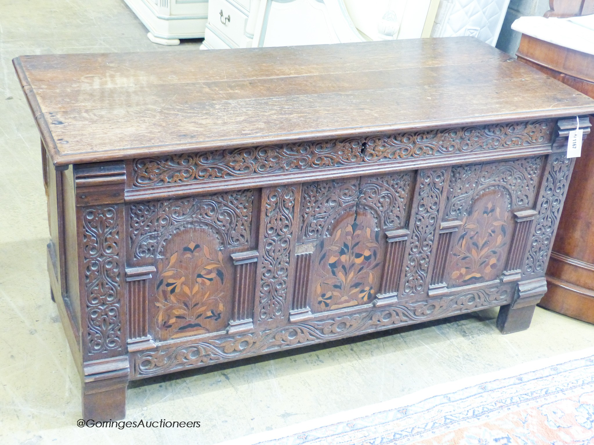 An 18th century marquetry inlaid oak coffer, width 130cm, depth 56cm, height 68cm
